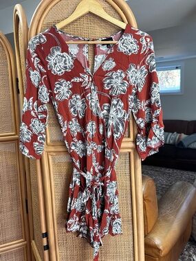 Who What Wear Rust Red Floral Wrap Romper with White and Black Blooms
